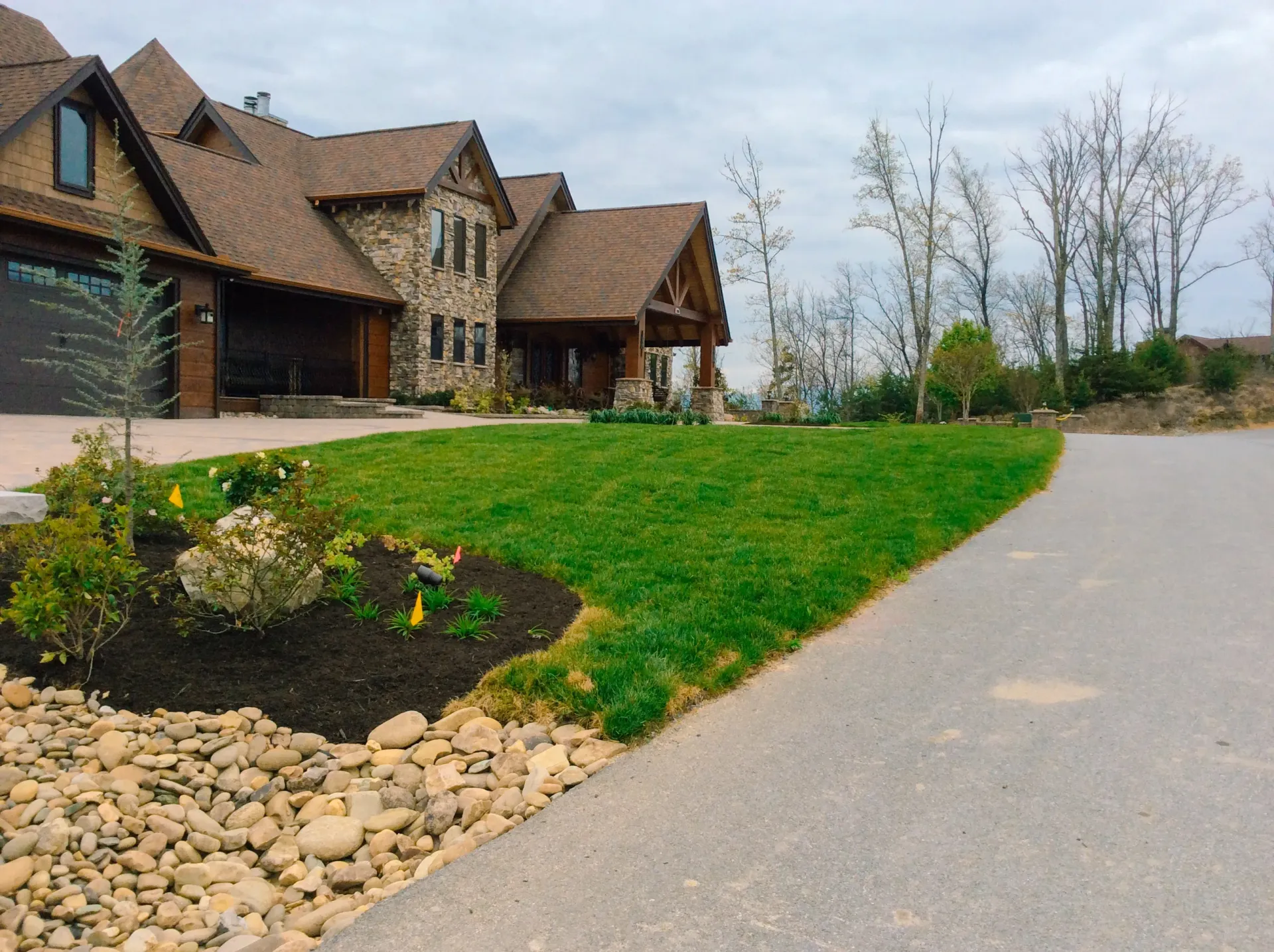 A large house with a driveway leading to it