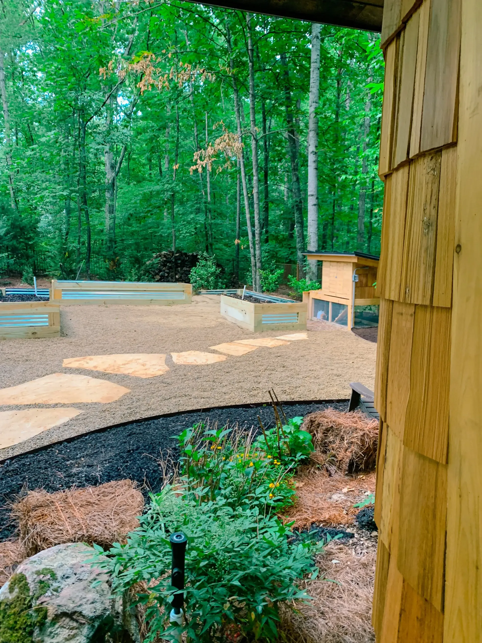 Garden path with natural stone pavers leading to the she shed entrance