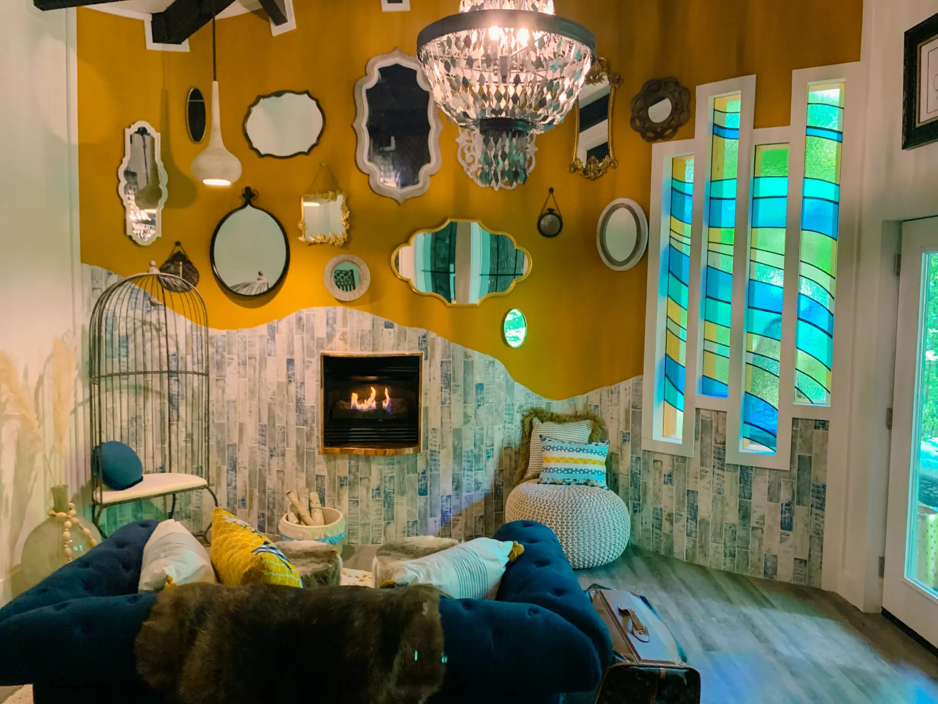 Custom interior with stained glass, antique mirrors, and rustic-modern furnishings