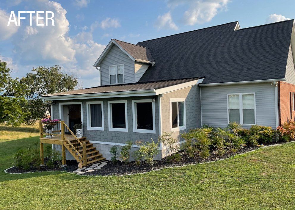An enclosed porch with wood stairs  in tennessee built by sunshien outdoor living 