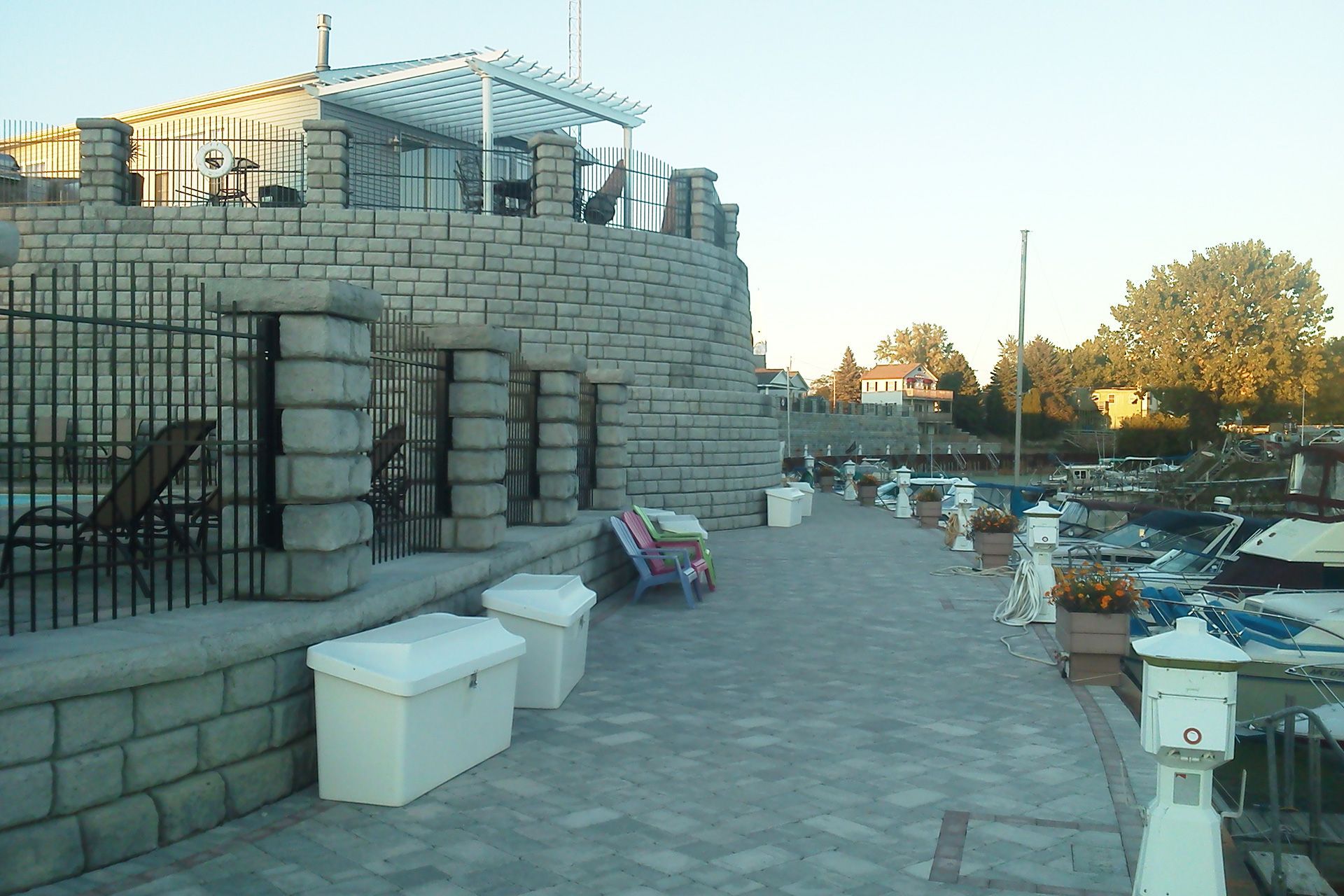 A brick wall with a fence around it and a number 5 on it