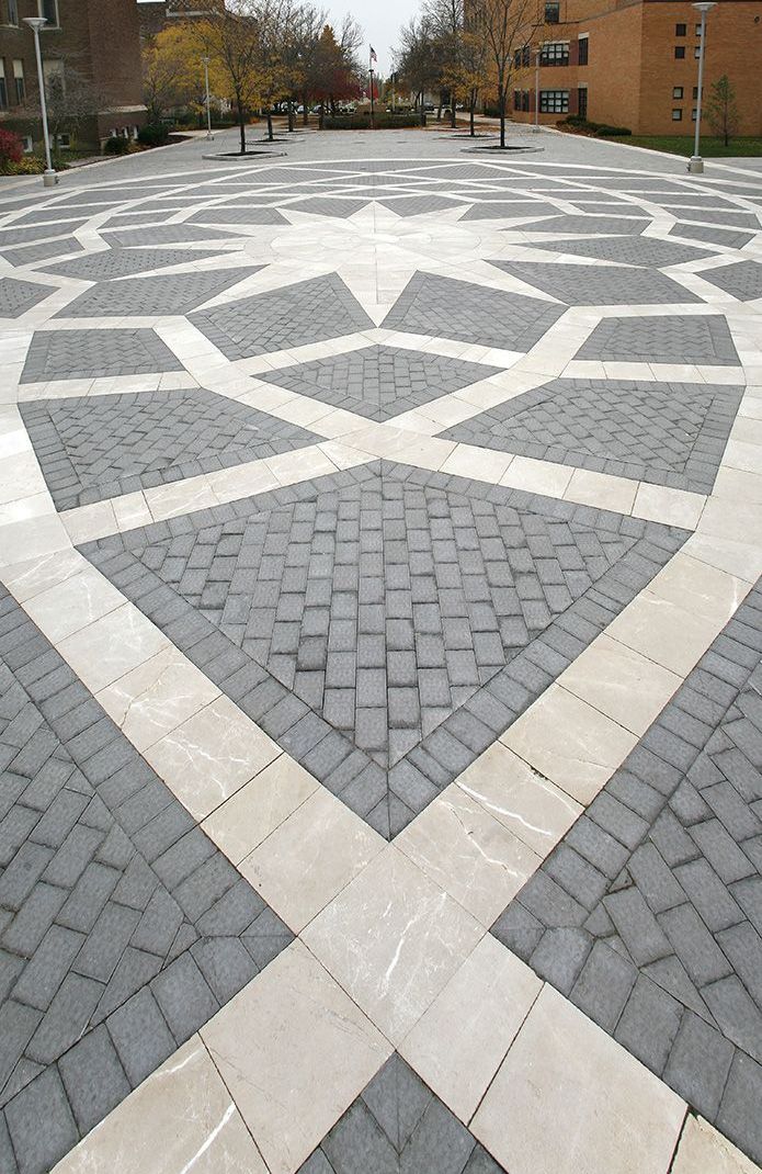 A large brick pavement with a geometric pattern on it