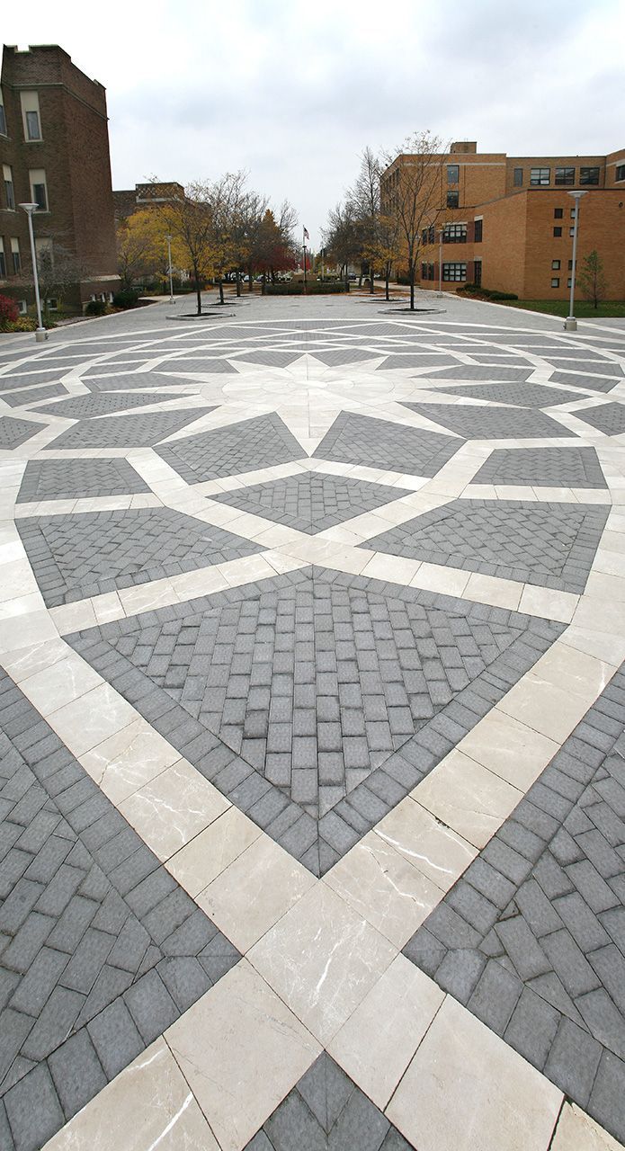 A large square with a circular pattern of bricks