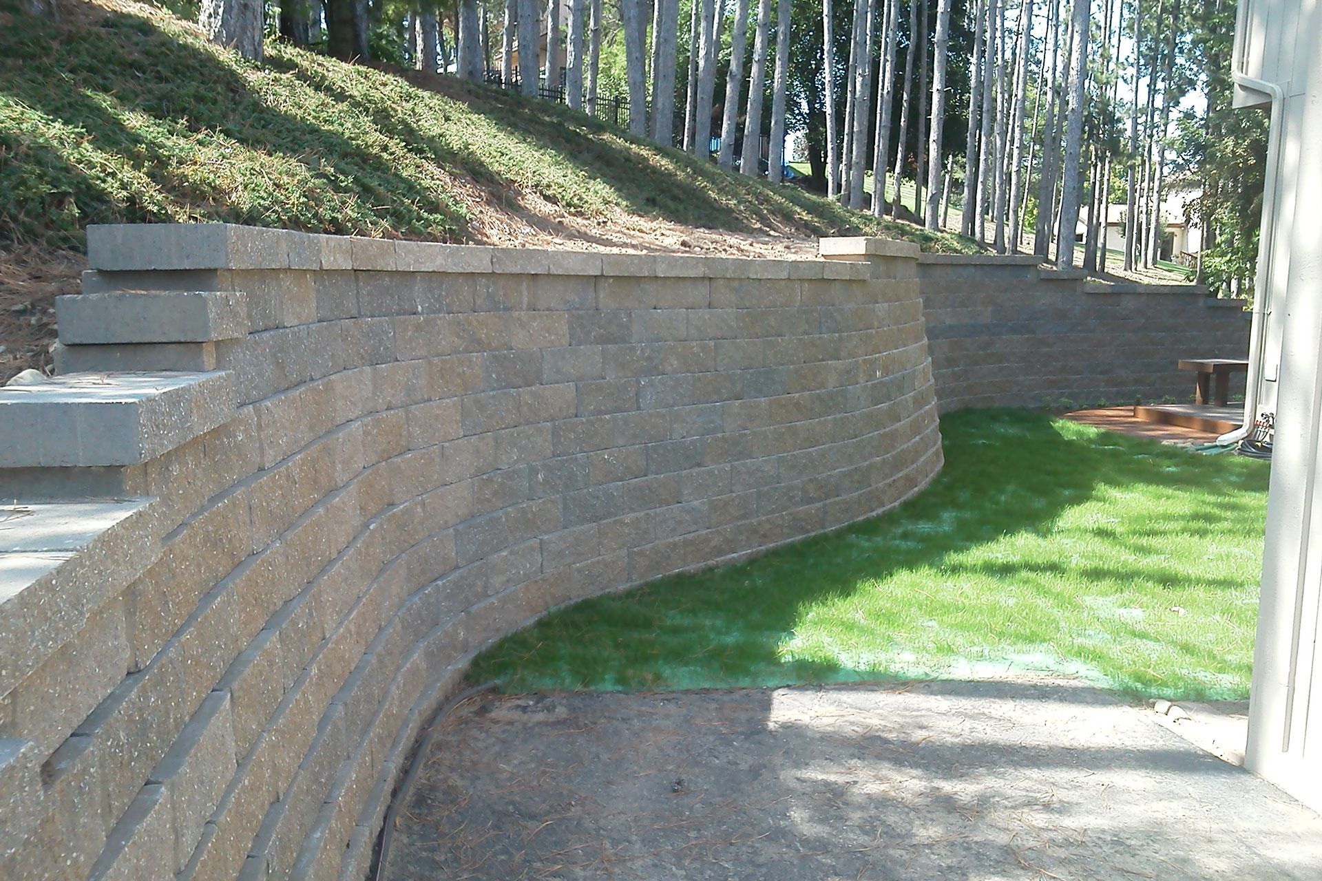 A brick wall with stairs leading up to it