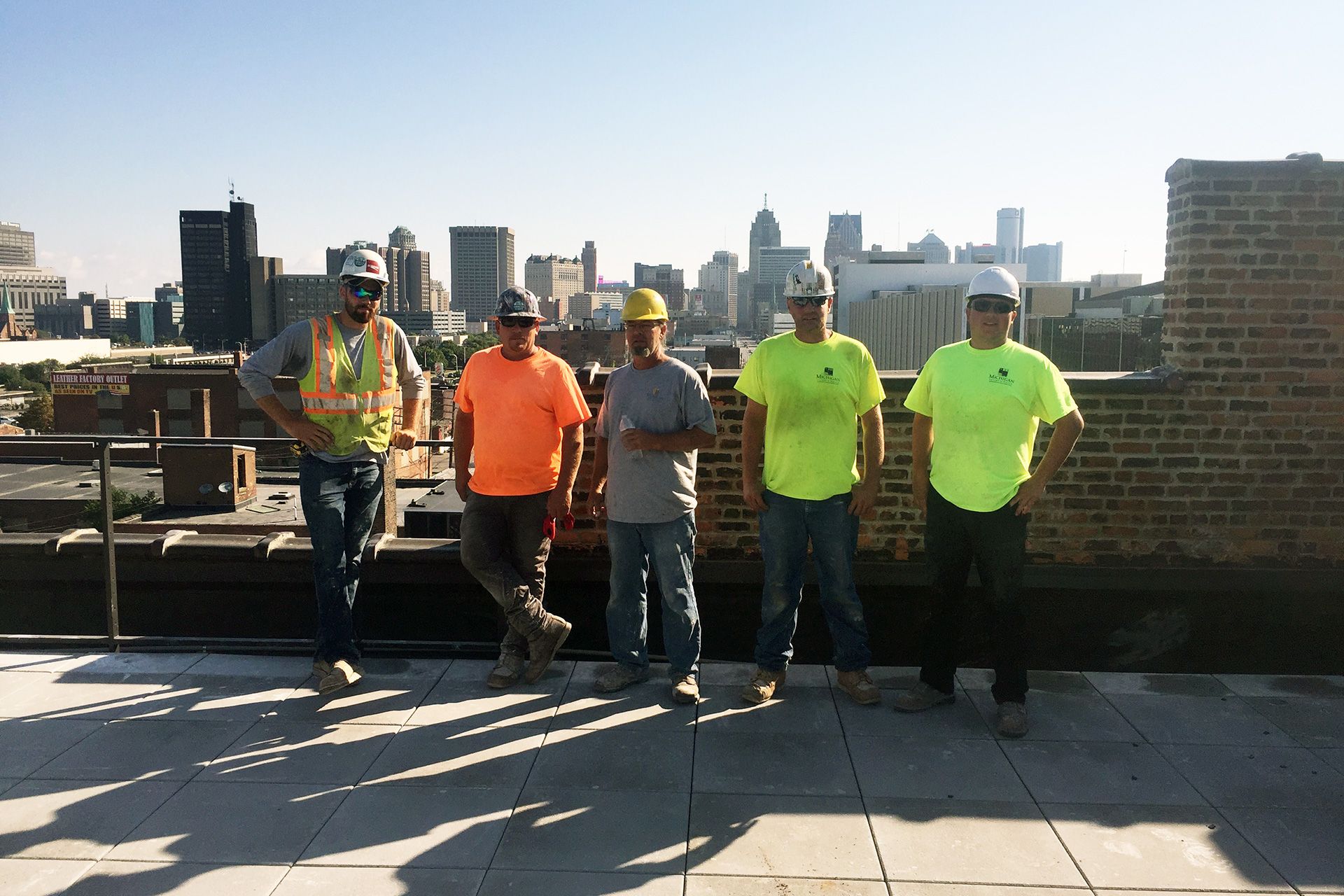 A group of construction workers are posing for a picture