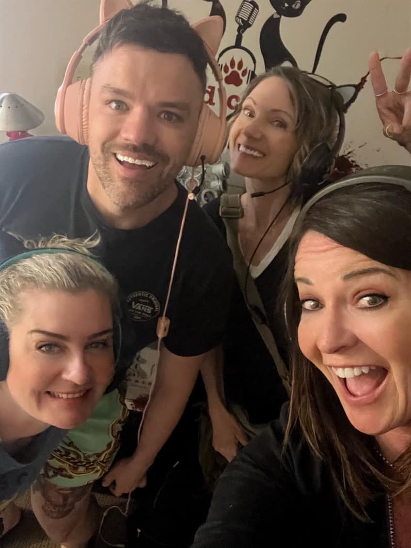 a group of people wearing headphones are posing for a picture