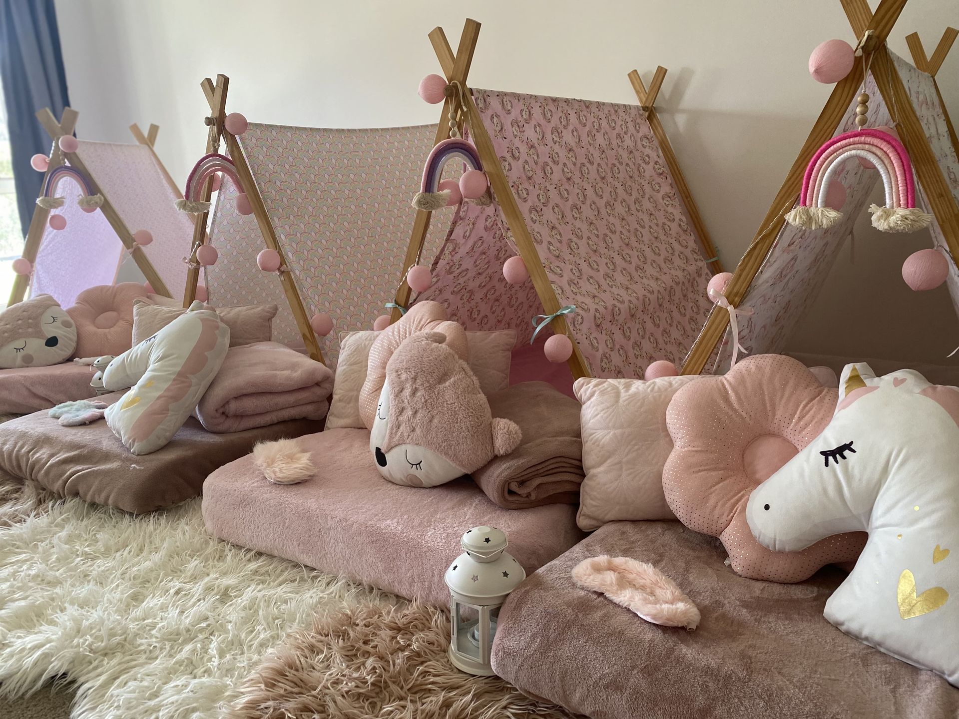 Group of Children and Teacher Playing with Rainbow cloth on green grass — Sweet Parties & Braids in Tatton, NSW