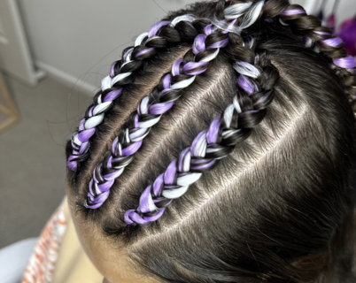 Hairdresser Applying Glitter paint on Braided hair of a Young girl — Sweet Parties & Braids in Tatton, NSW