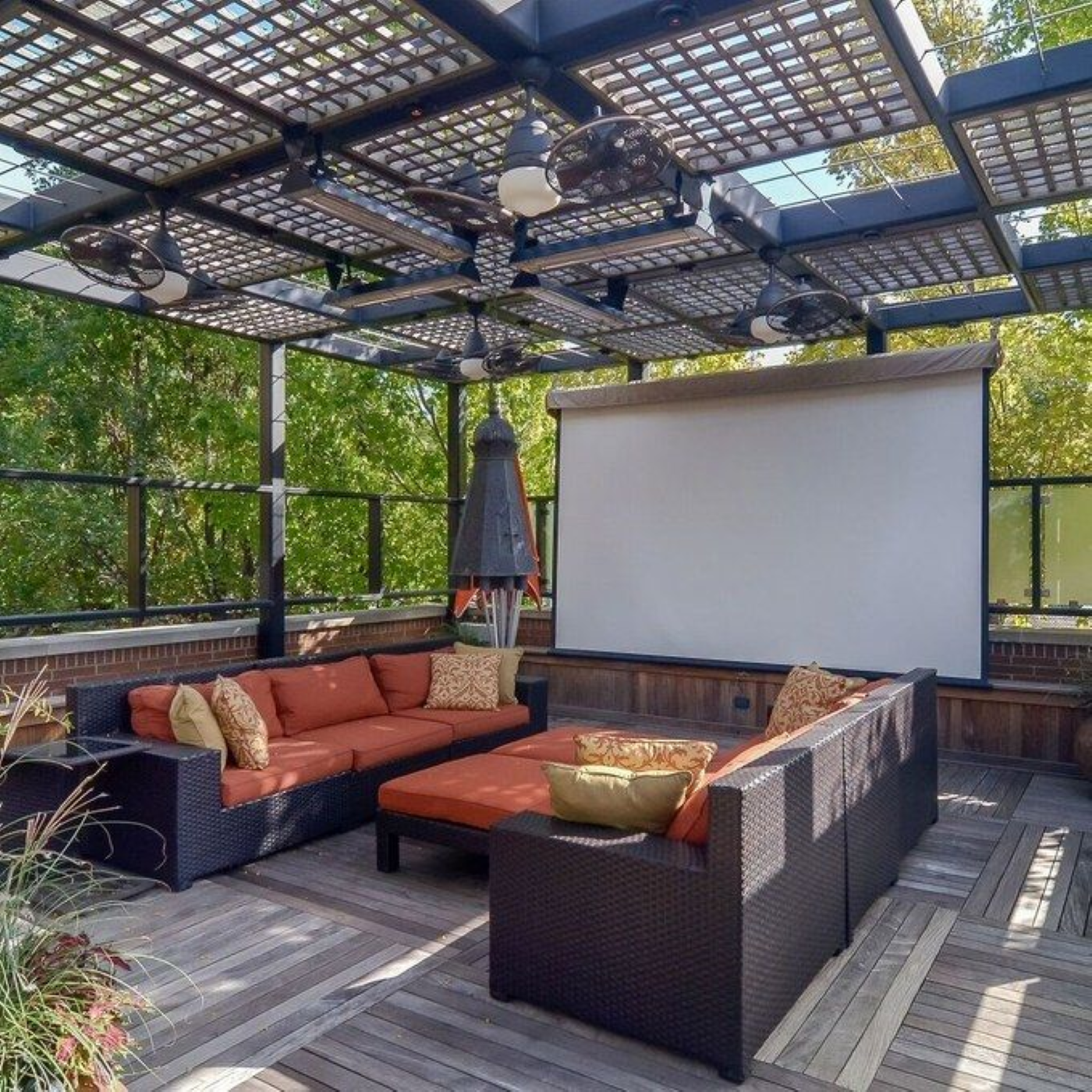 a patio with a projector screen and a couch