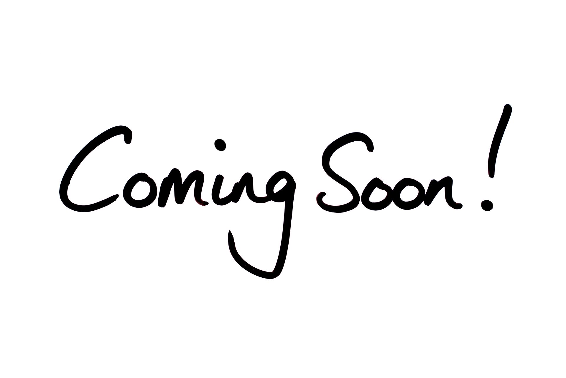 The word coming soon is handwritten in black ink on a white background.