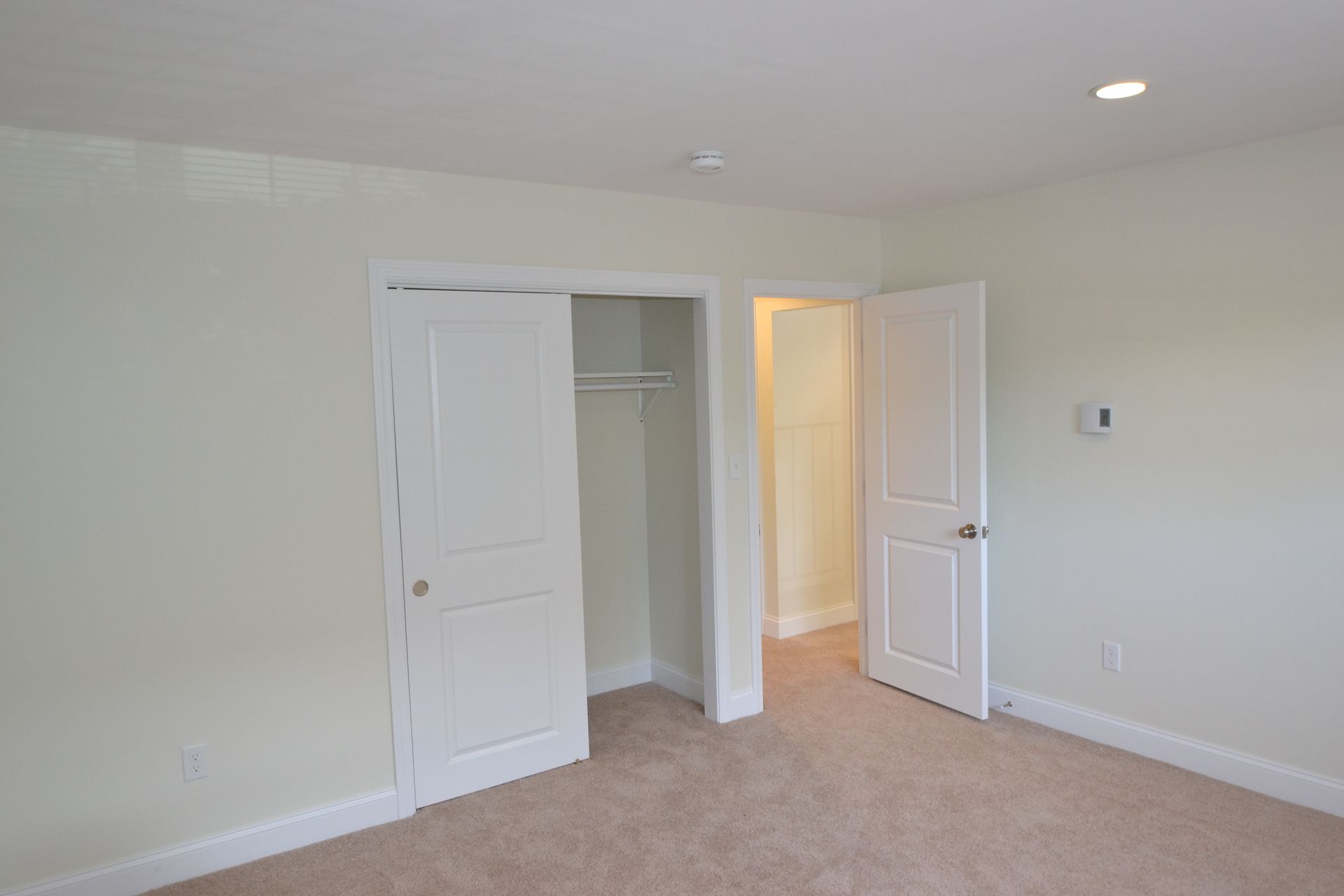 There is a closet in the middle of the room.