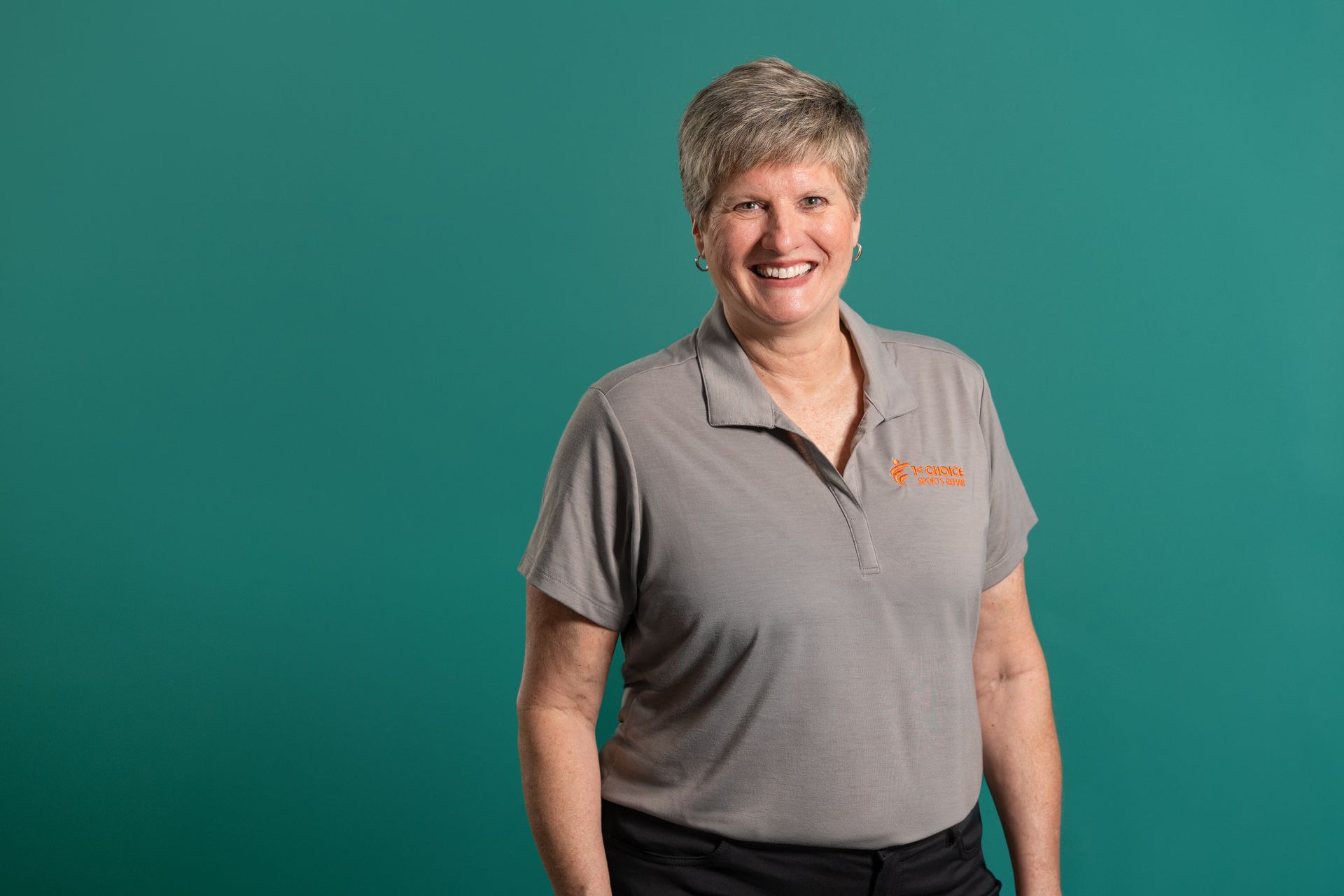 A silhouette of a woman 's head in a circle.