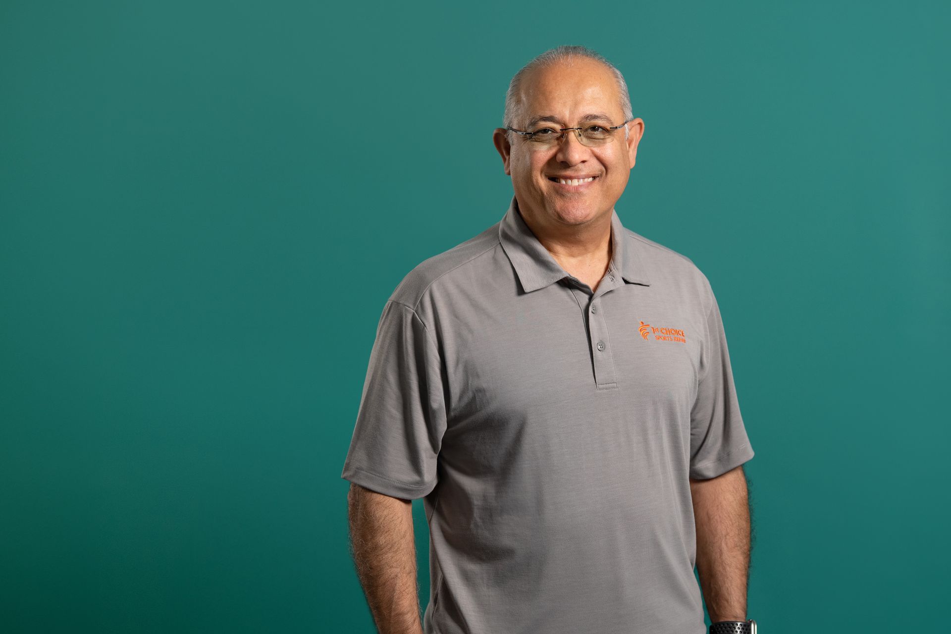 A man in a black shirt is smiling for the camera