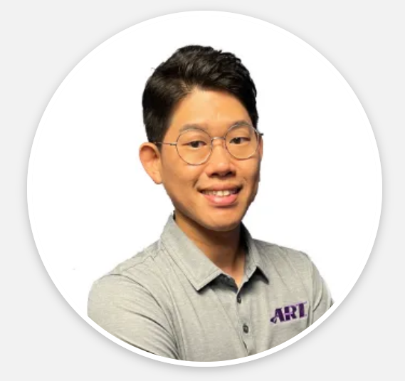 A man wearing glasses and a shirt that says ari