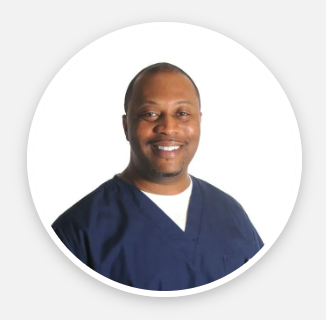 A man in a blue scrub is smiling in a white circle