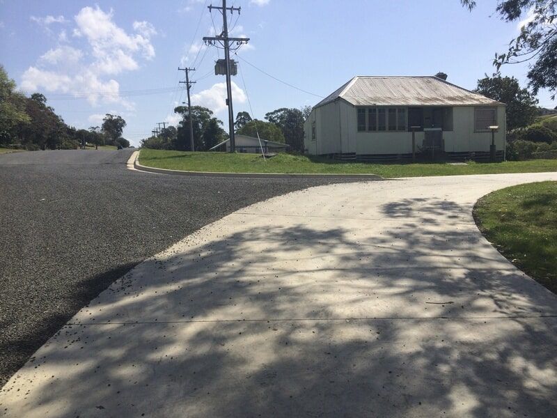 Subdivision of a Concrete Road Near House — Elmac Plant Hire In Taree