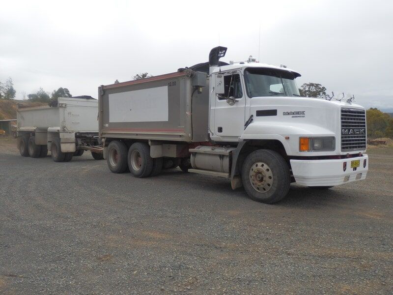 Dump Truck with Attached Dog Trailer Filled with Dirt — Elmac Plant Hire In Taree