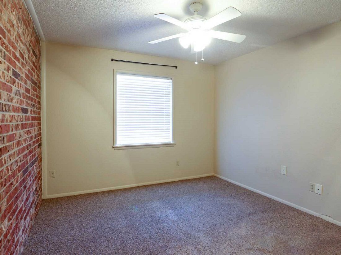 apartment bedroom with carpet