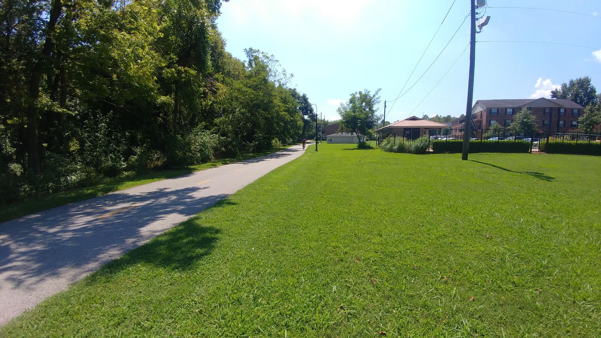 apartment building walkway and lawn area