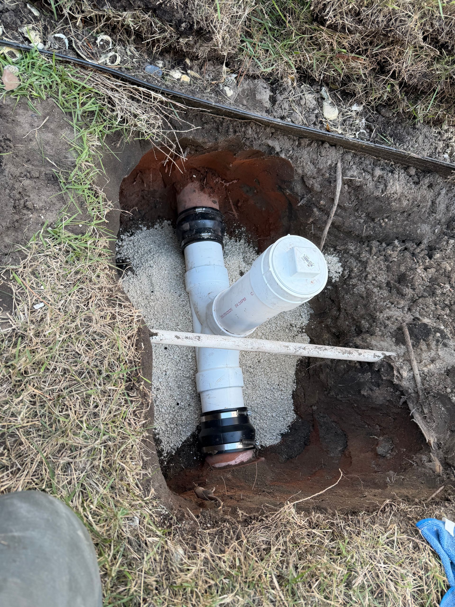 Woman and repair person shaking hands in a kitchen, tool belt visible. Woman and repair person shaking hands in a kitchen, tool belt visible.