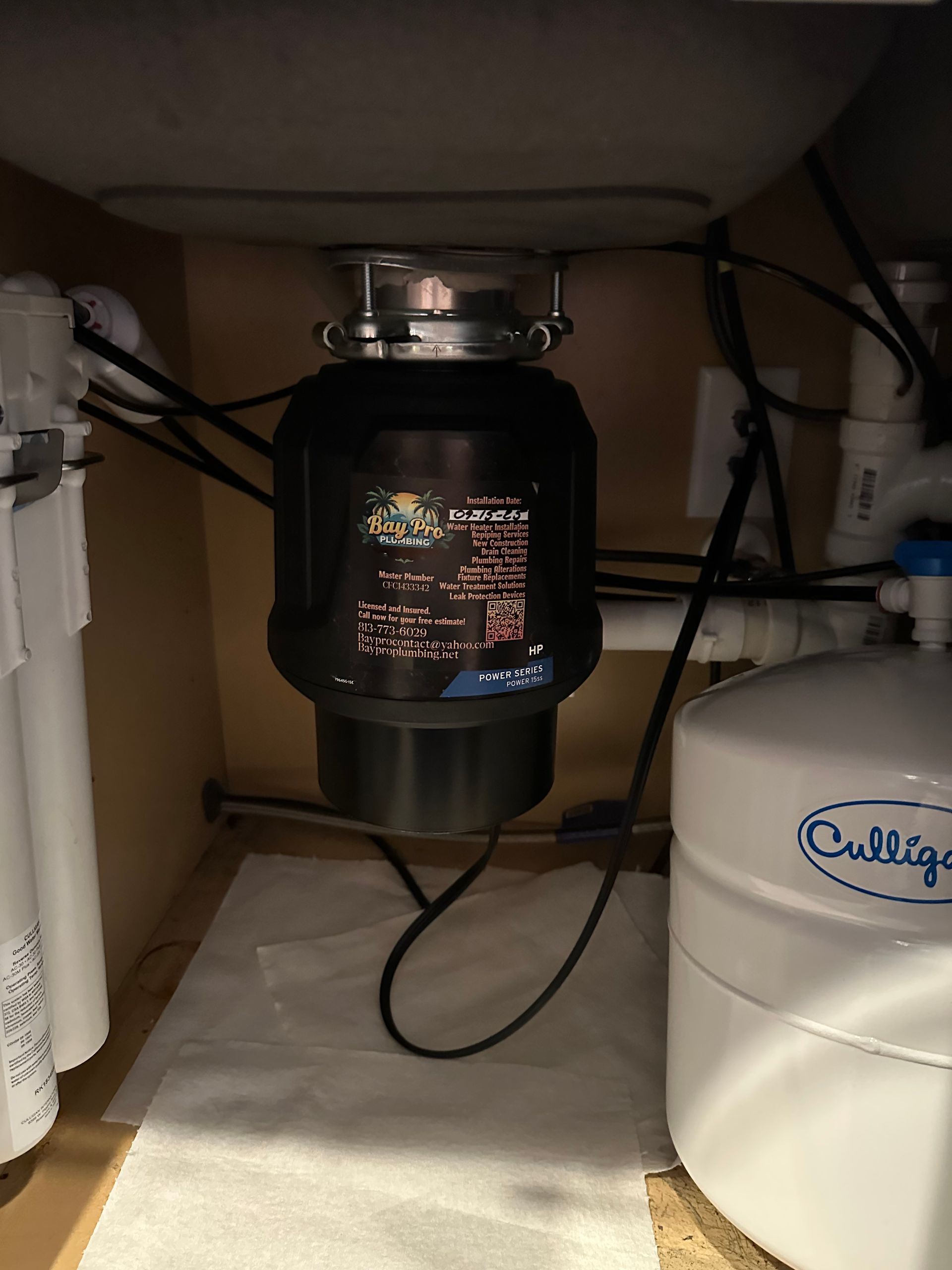 Plumber in gloves working on colorful pipes. Plumber in gloves working on colorful pipes.