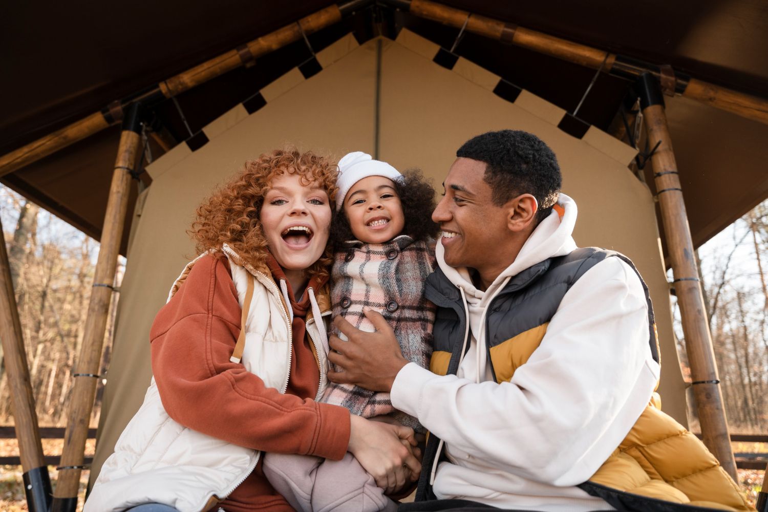 A woman is sitting at a desk with a computer and a sign that says ksw