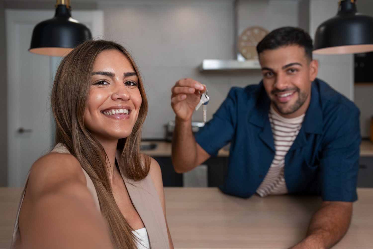 Man in plaid shirt smiles at child from car window.