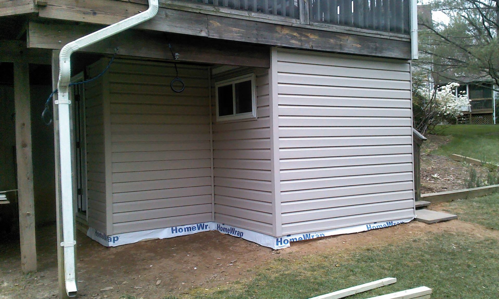 A house with a gutter on the side of it