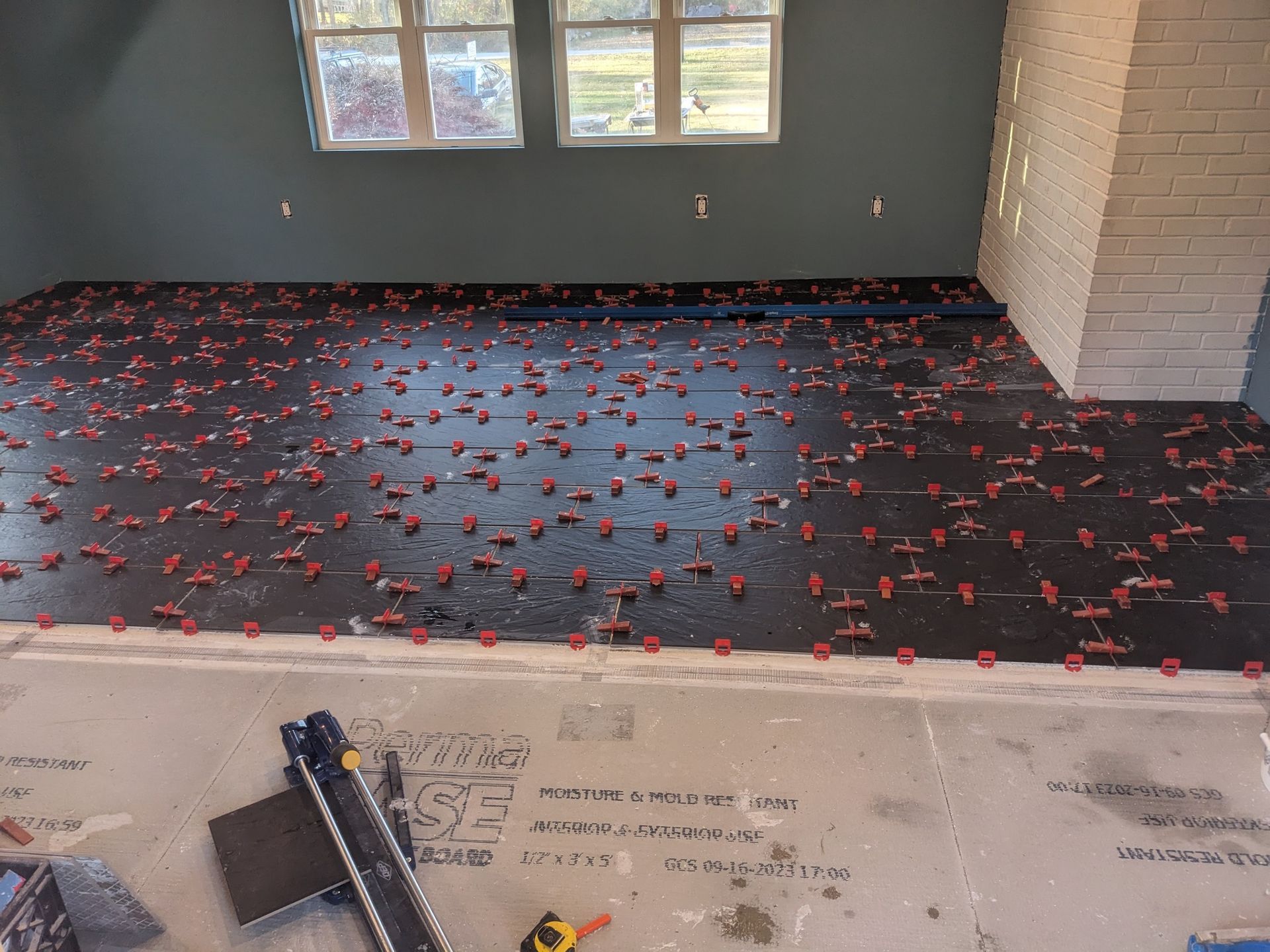 A room with a lot of tiles on the floor