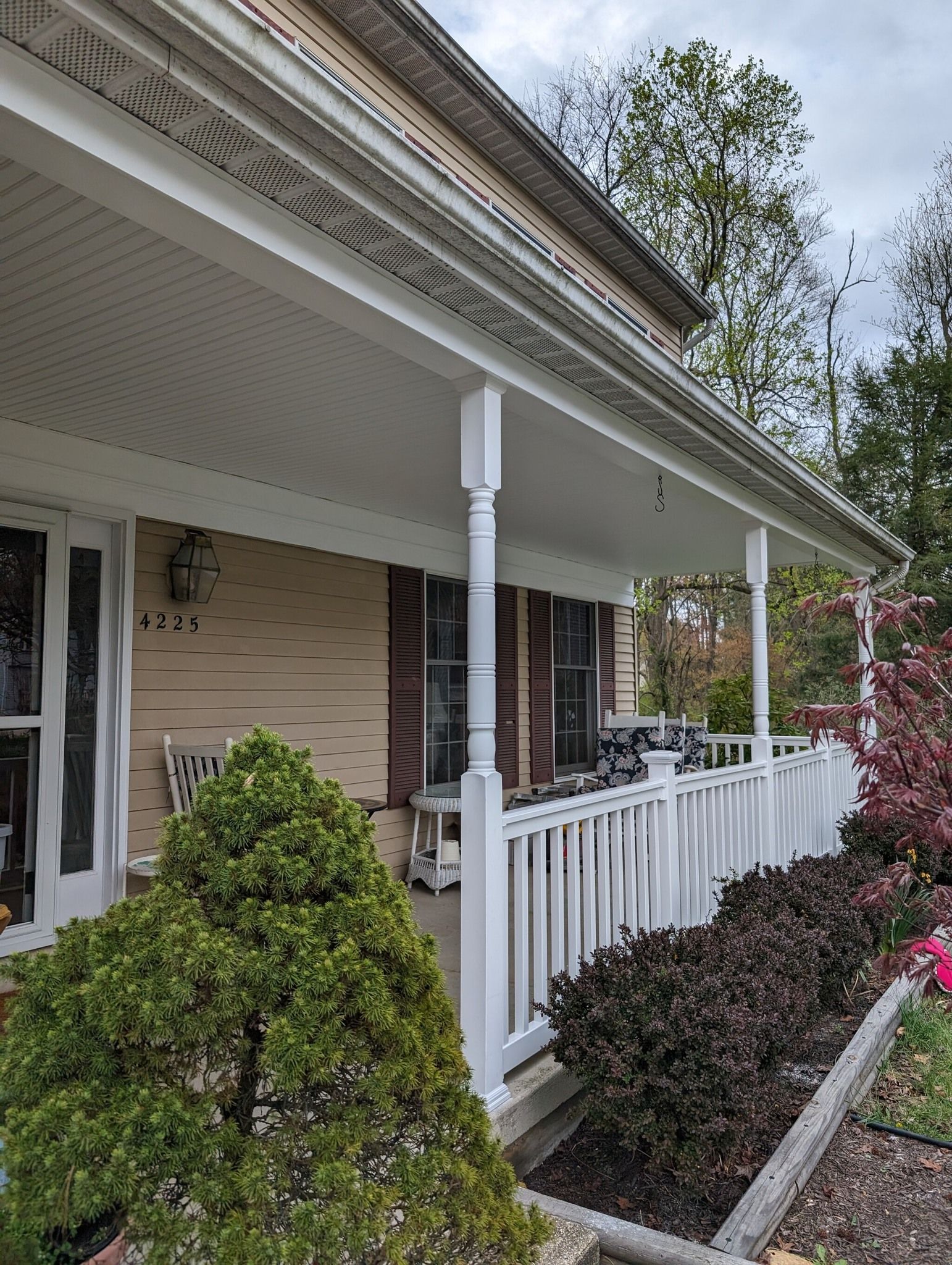 A house with a porch and a white railing
