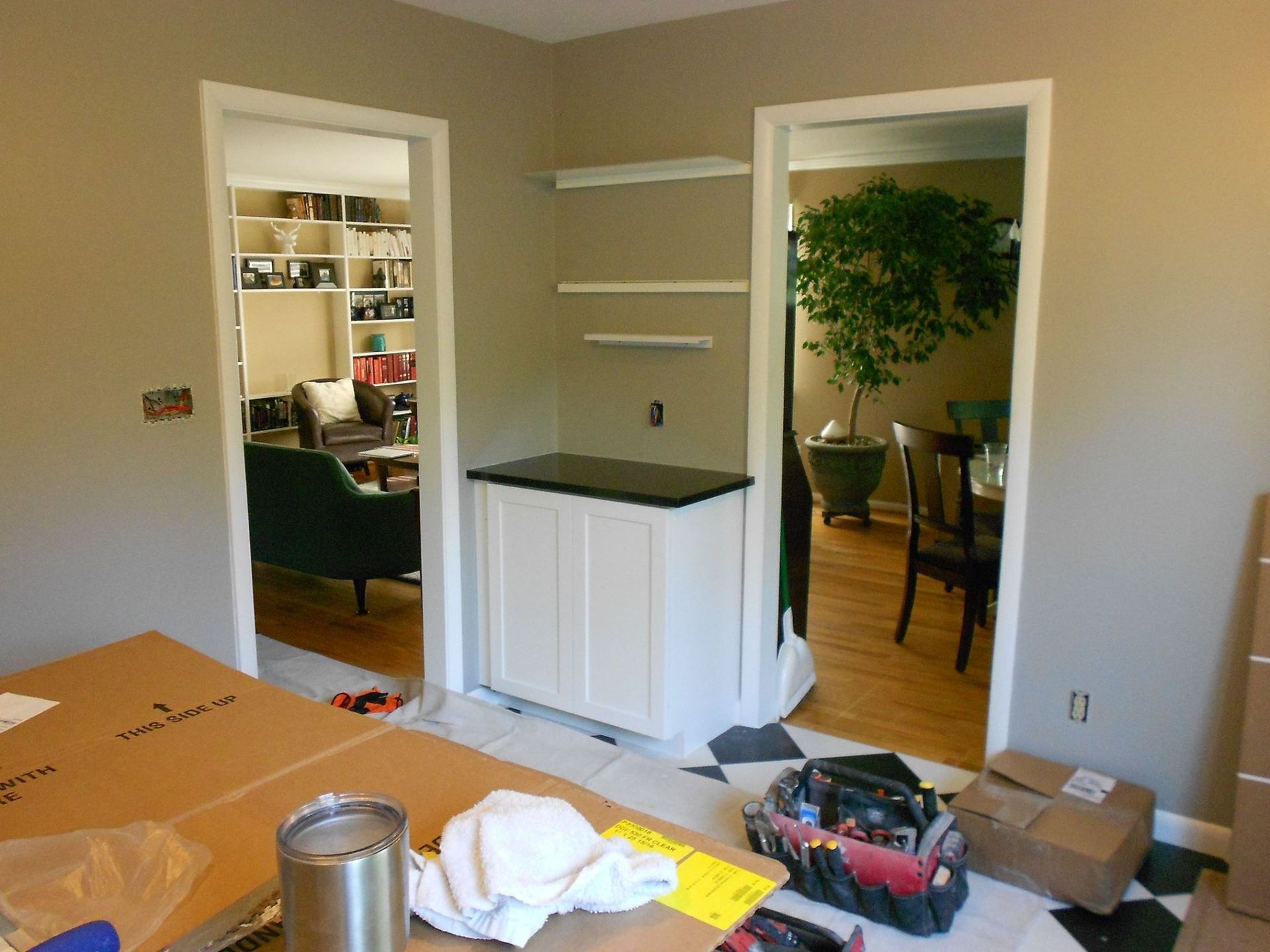 A room that is being remodeled with boxes on the floor