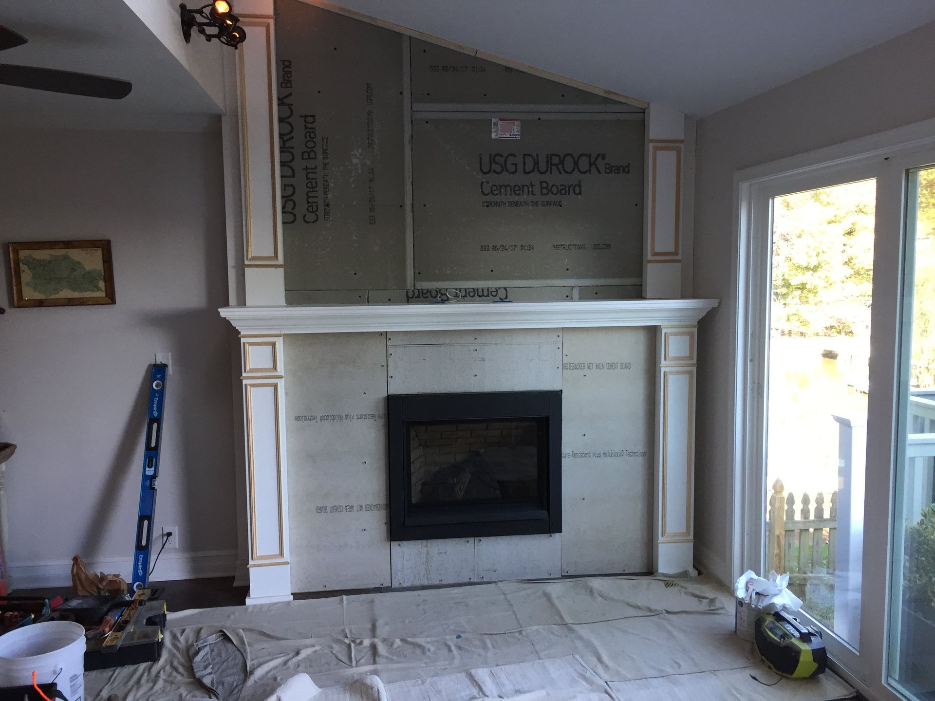 A living room with a fireplace and a sign that says usc durock