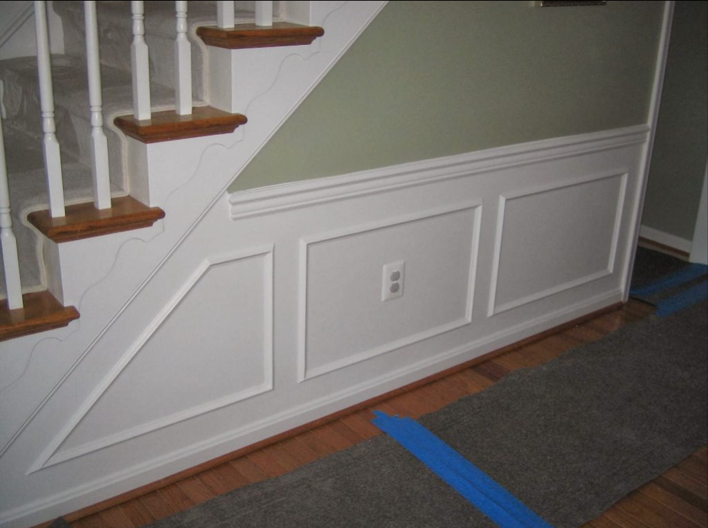 A staircase with a blue tape on the floor