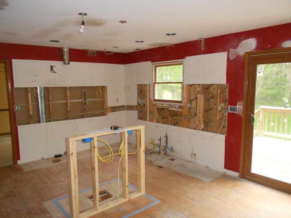 A kitchen under construction with a wooden frame in the middle