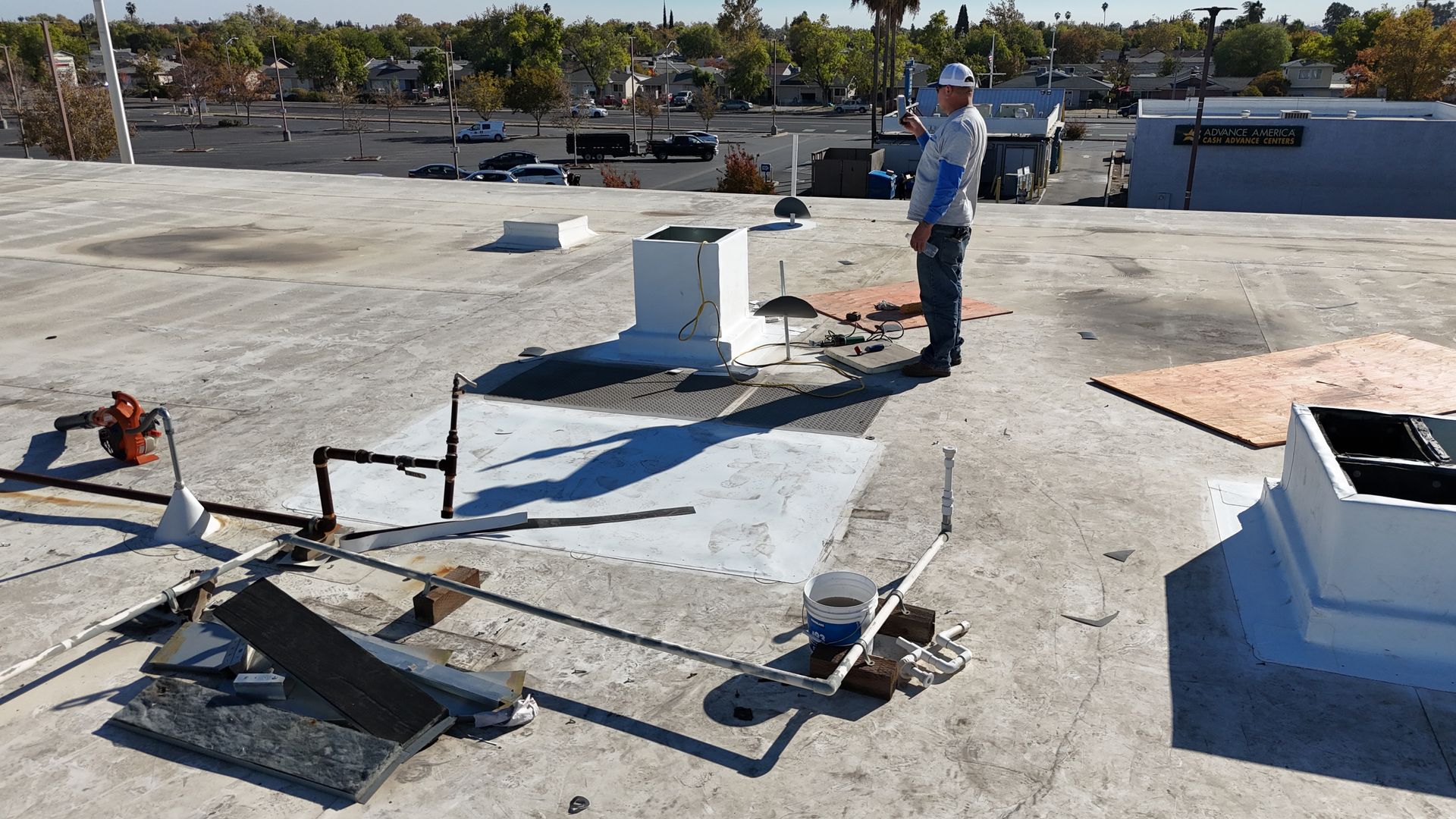 A man standing on top of a concrete roof