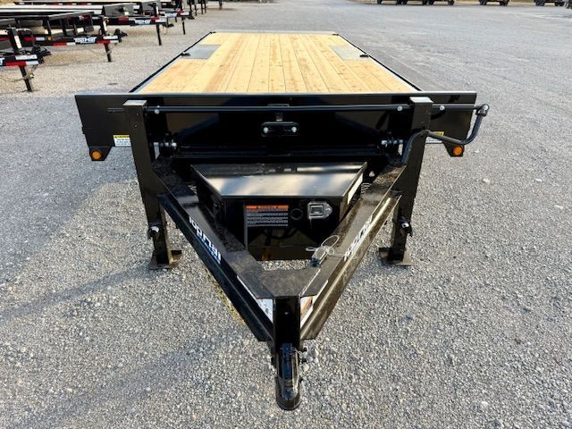 A bulldozer is sitting on top of a trailer.