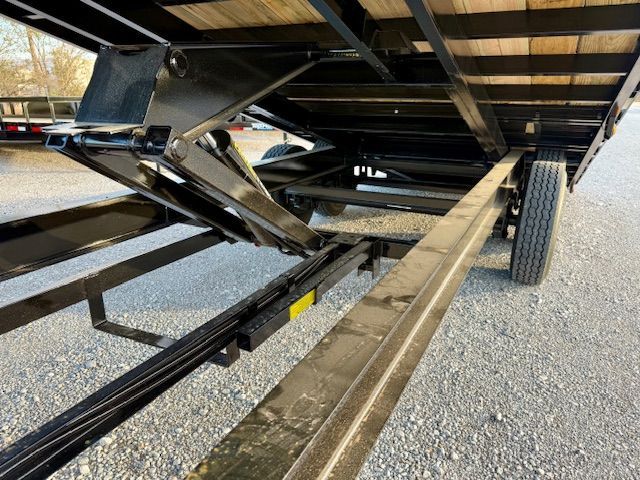 A white car is sitting on top of a trailer.