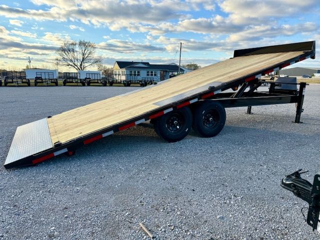 A winch is sitting on top of a wooden deck.