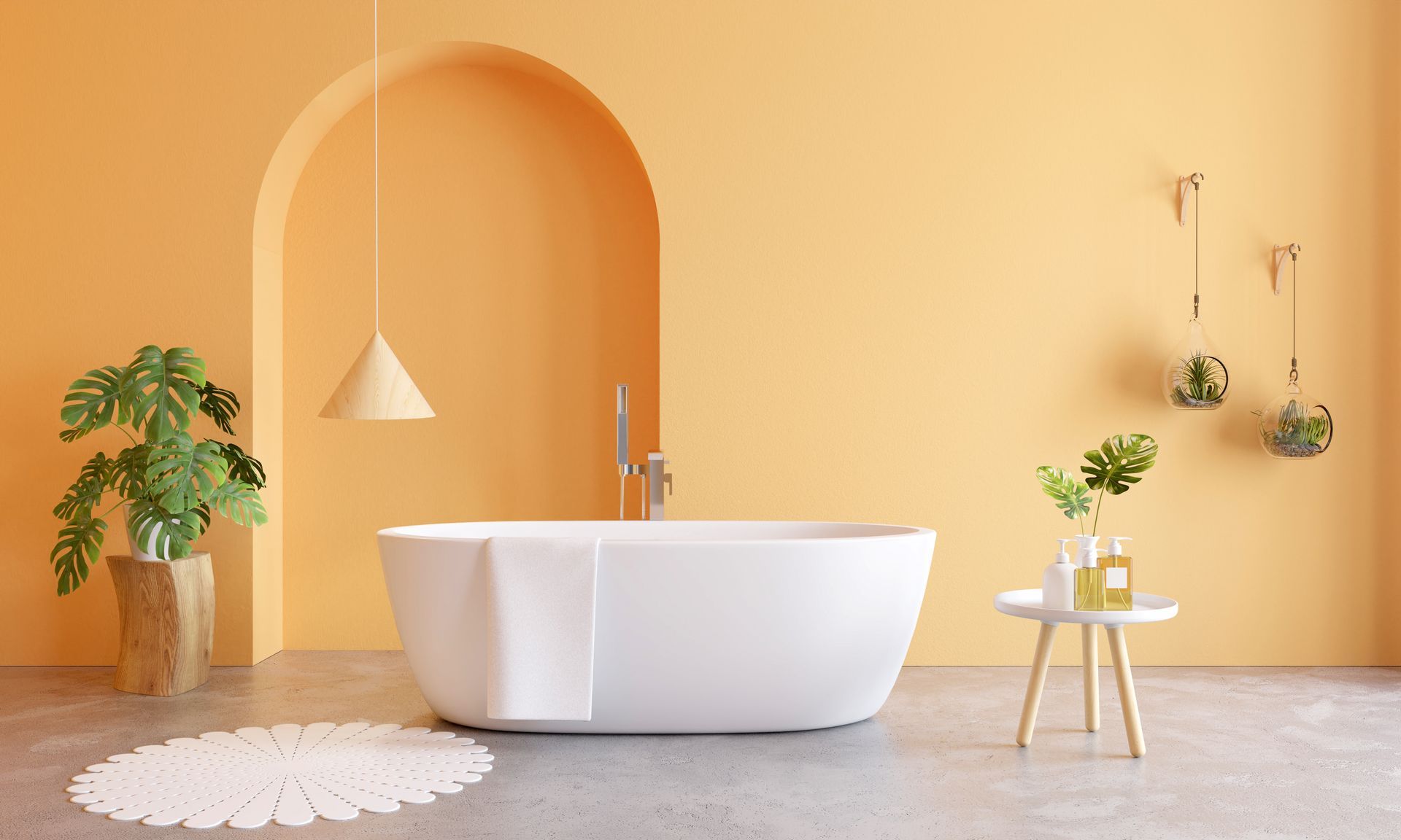 Bright modern bathroom with a white freestanding tub, peach walls, plants, and hanging decor