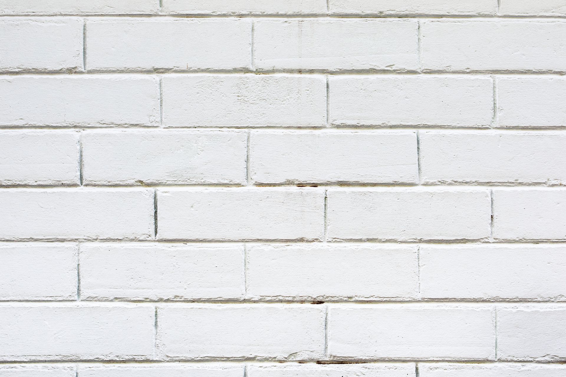 A close up of a white brick wall.