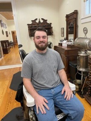 Guy In Grey Shirt After Haircut — New Orleans, LA — Bad Habit Barber Shop
