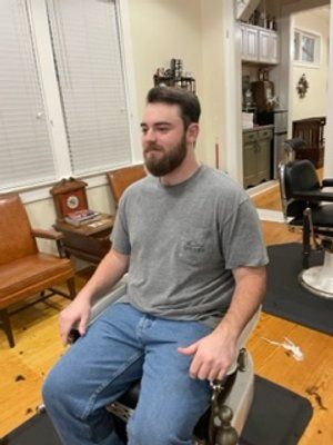 Guy In Grey Shirt After Haircut Other Side View — New Orleans, LA — Bad Habit Barber Shop