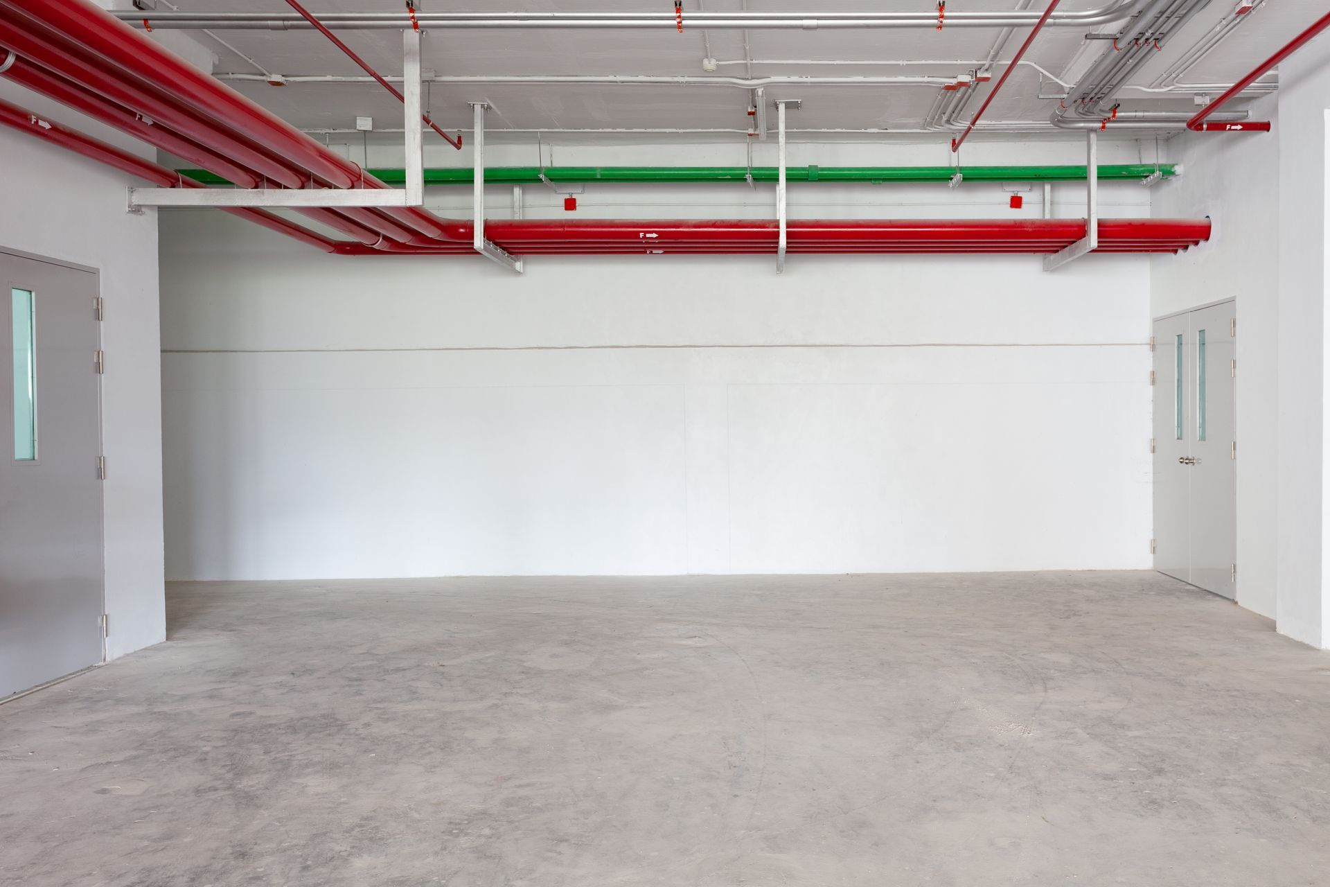 Empty room with concrete floor.