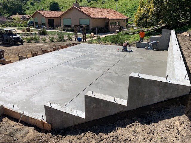 Concrete construction site with workers.