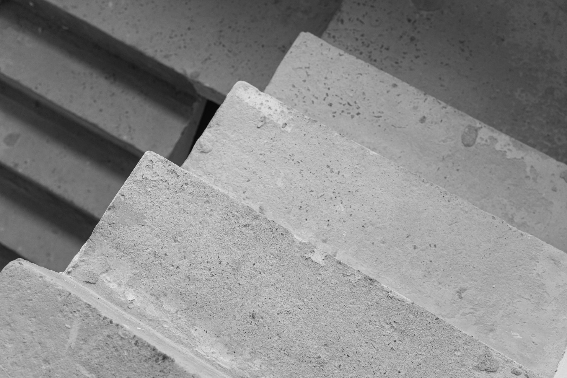 Concrete stairway viewed from above, steps descending.