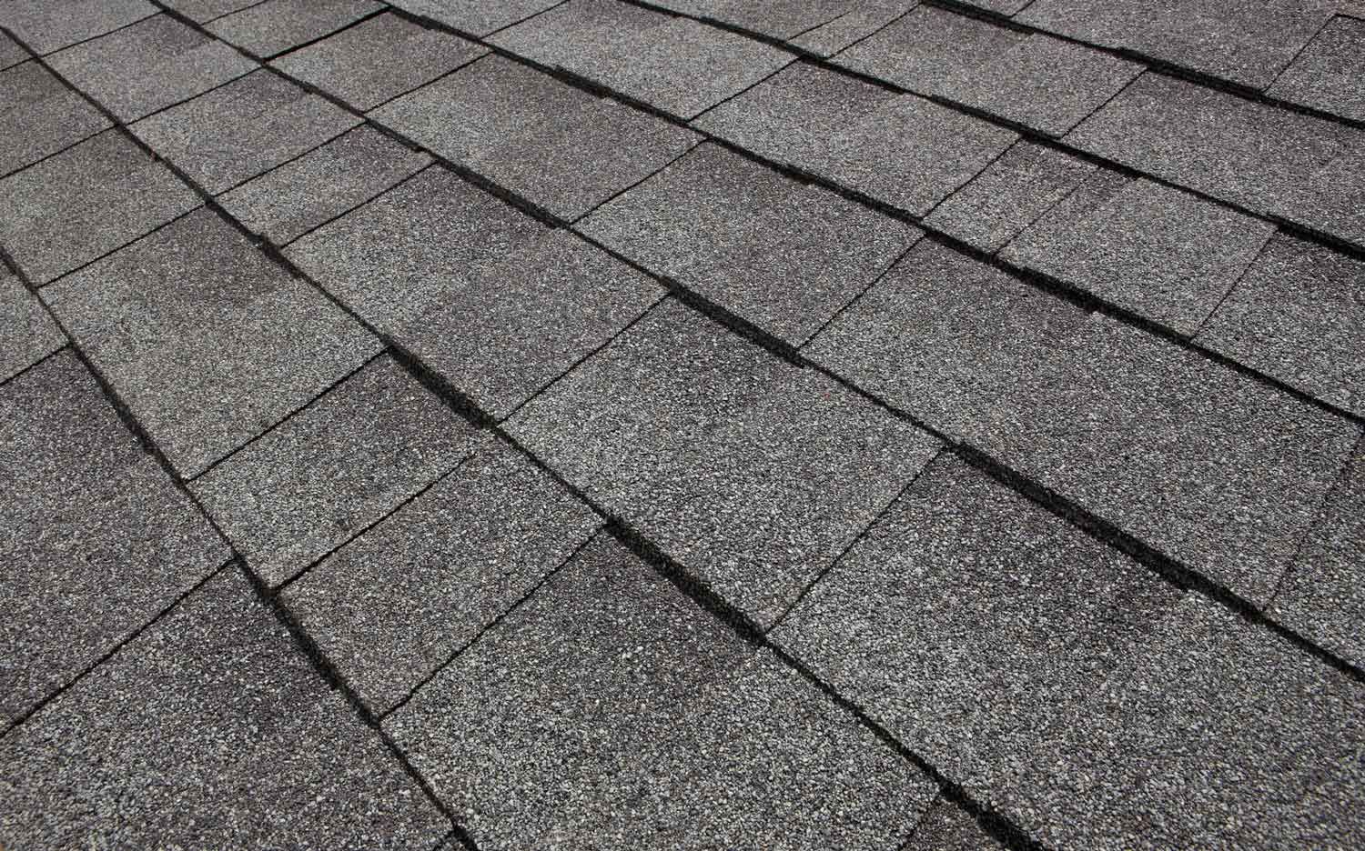 A close up of a roof with shingles on it.
