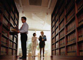 Lawyers — Sexual Harassment Attorneys in a Law Library in Legal Services