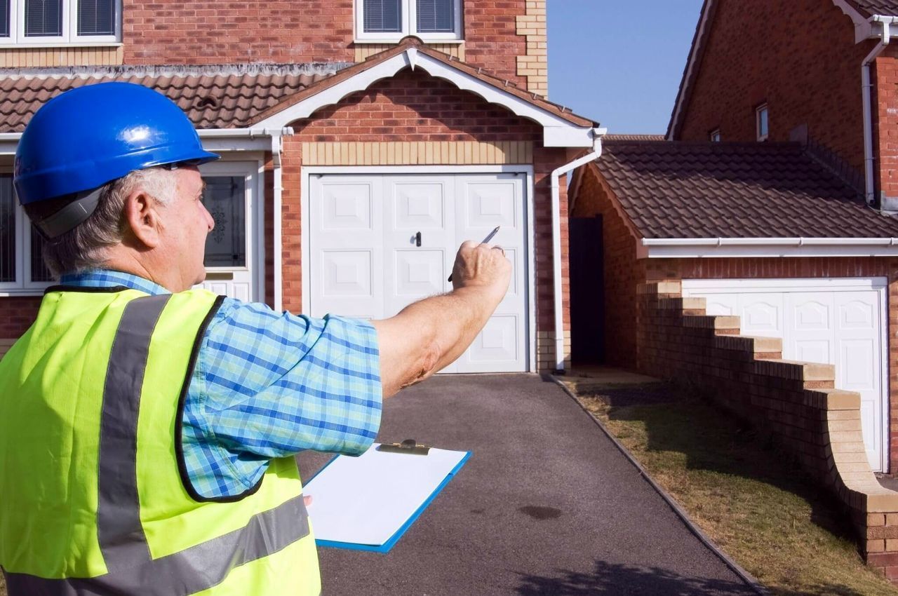 Building surveyor assessing a residential property during inspection