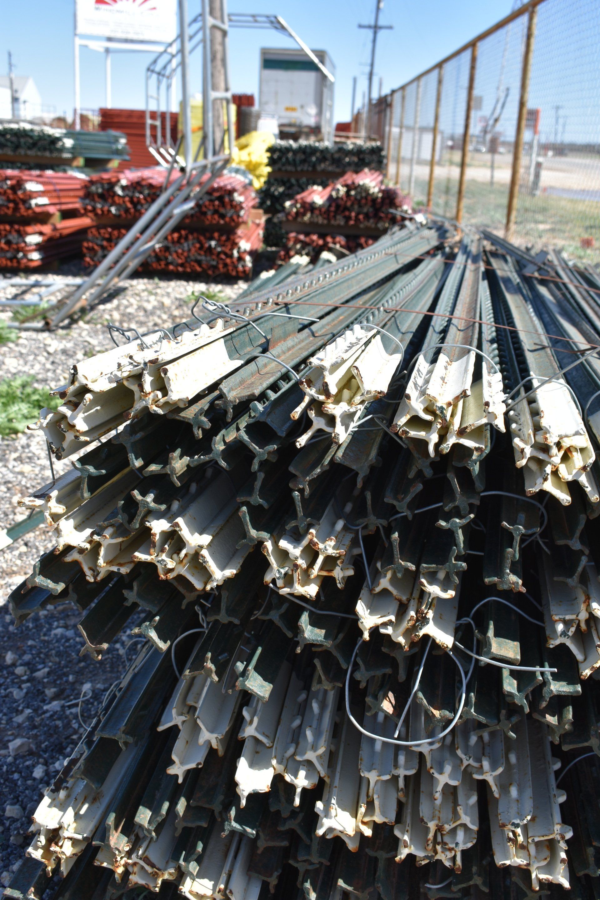 stack of metal fencing stakes