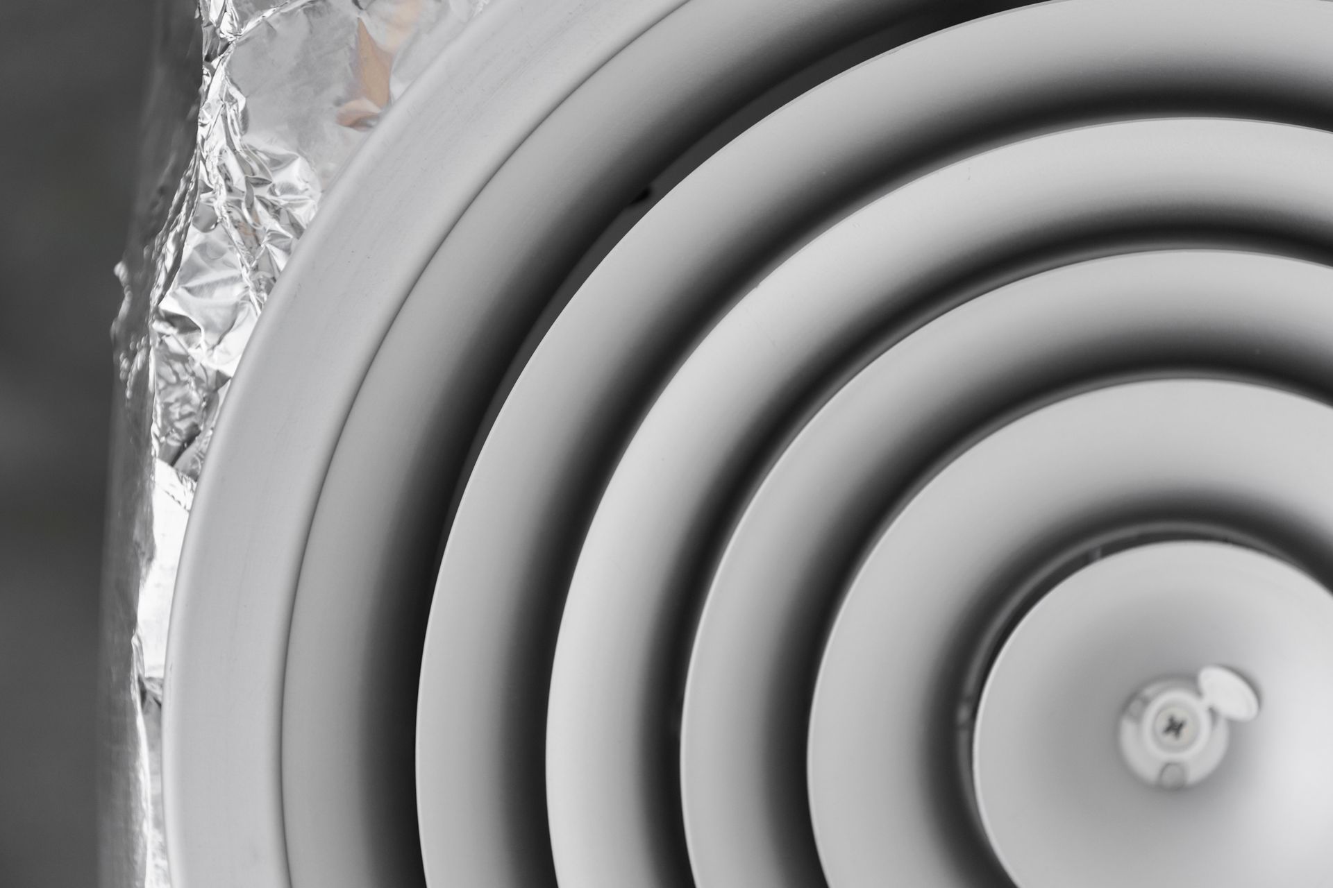 A close up of a white circular object on a wall